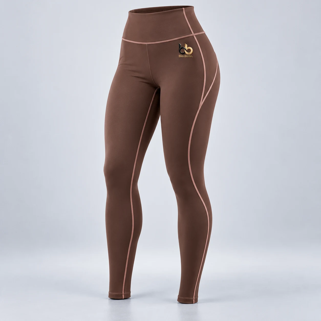 Training leggings — warm cocoa brown with pale rose seam accents